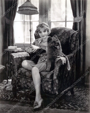 Alice White read a book with her dog for a little company 8b20-1598