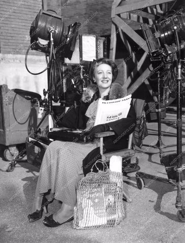 candid Gertrude Lawrence on set with a bunch of reading material 8b20-16958