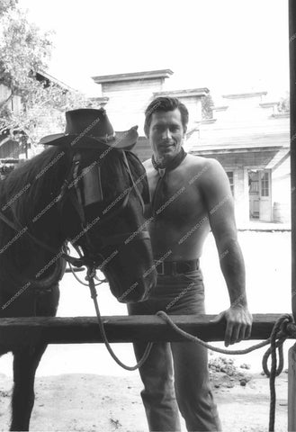 shirtless Clint Walkerr puts his hat on his horse 8b20-16992