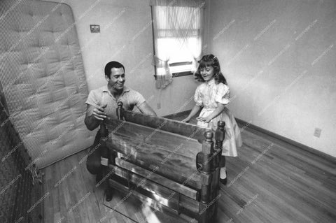 Clint Walker setting up his daughter's bed 8b20-16997