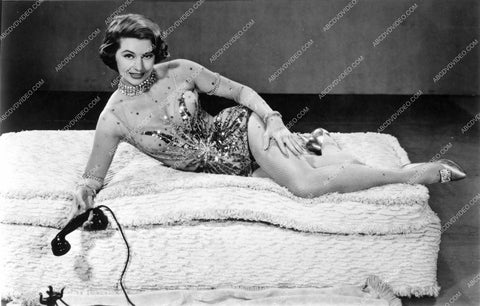 Cyd Charisse takes a telephone call 8b20-17018