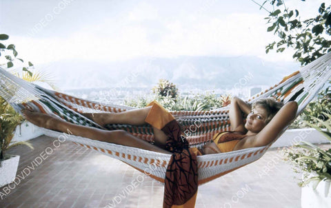 Claudia Cardinale lounging in a hammock 8b20-17145