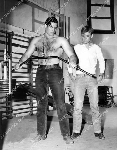 Clint Walker helps Will Hutchins in the weight room 8b20-17209