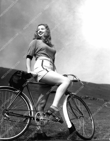 candid Diana Dors goes for a bicycle ride 8b20-17307