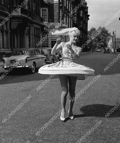 Elke Sommer spinning her skirt in the street 8b20-17473