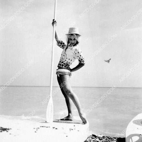 Elke Sommer posing at the beach 8b20-17492
