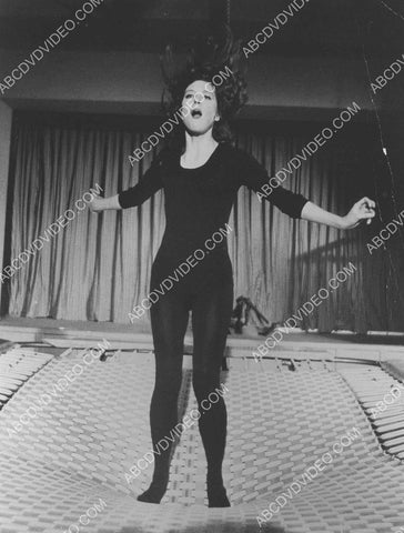 Diana Rigg bouncing on the trampolene 8b20-17523