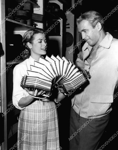 candid Grace Kelly gives James Stewart accordian lessons 8b20-17623