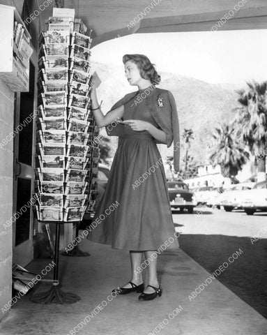 candid Grace Kelly picking out some postcards 8b20-17632