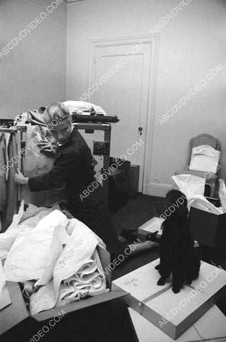 Grace Kelly looks to her dog for help w her packages 8b20-17648