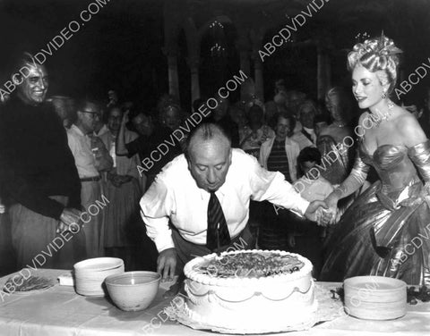 candid Cary Grant Grace Kelly watch Alfred Hitchcock blow out Birthday Cake candles 8b20-17651