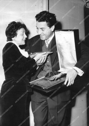 Edith Piaf looking at rings I think 8b20-17739