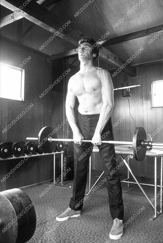 Clint Eastwood working out in his weight room 8b20-17954