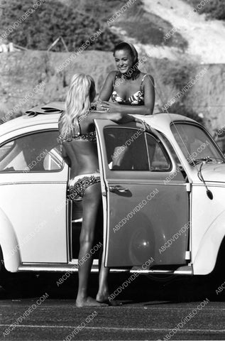 Patti Chandler and bikini babe buddy get into VW Bug automobile 8b20-18819