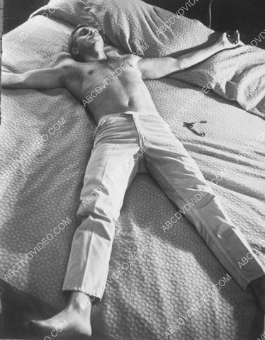 Steve McQueen sprawled out on the bed 8b20-19032