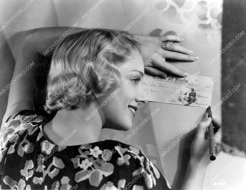 Leila Hyams signing a check 8b20-20384