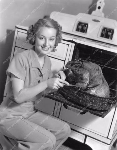 Anne Shirley hard at work preparing turkey Thanksgiving Dinner 8b20-2821
