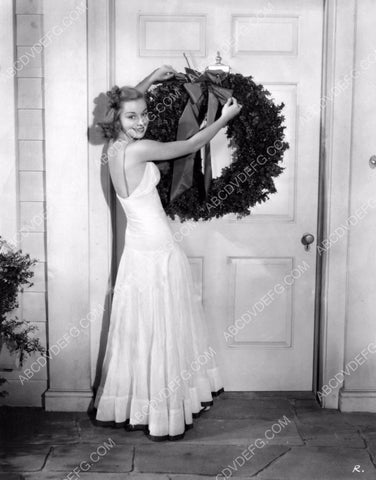 Anne Shirley hanging Christmas Wreath on the front door 8b20-2825