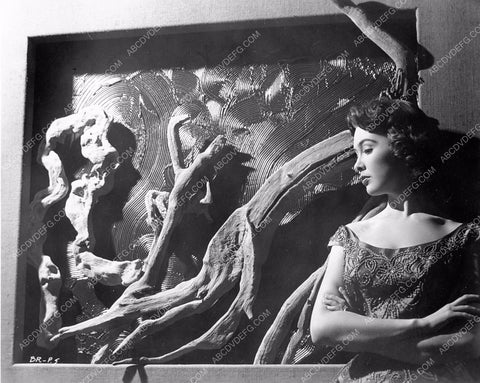 Barbara Rush poses next to driftwood artwork 8b20-3430