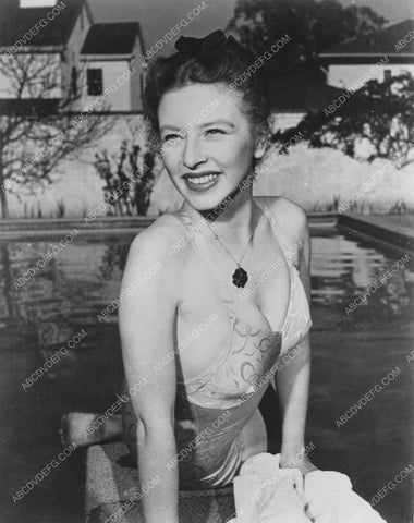 Amanda Blake sitting on the diving board by the pool 8b20-3707