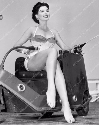 sexy Ann Miller does a little fishing off the side of motor scooter dp-4123
