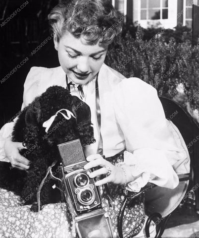 candid Anne Baxter breaks out the camera for her poodle dog 8b20-4180