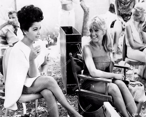 Annette Funicello and someone enjoy a little down time between shots 8b20-4364