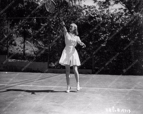 athletic Bette Davis out on the tennis court smacking the ball 8b20-4757
