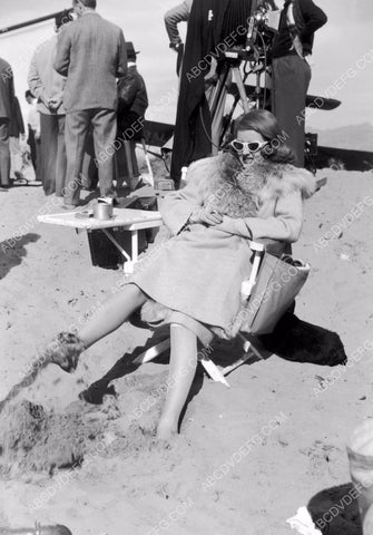 candid Bette Davis wiggling her toes in the sand between takes 8b20-4787