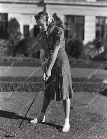 athletic Betty Grable test out her new golf clubs 8b20-4846