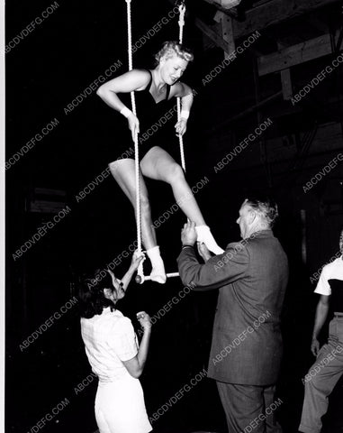 athletic Betty Hutton practices on circus trapeze swing 8b20-4907