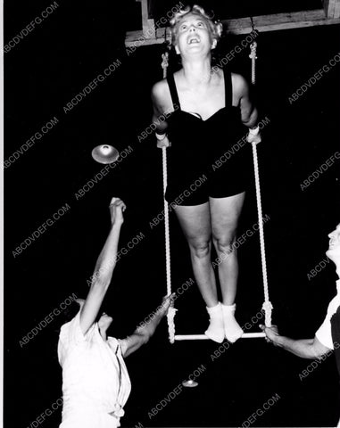 athletic Betty Hutton practices on circus trapeze swing 8b20-4908