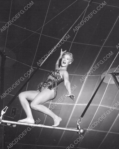 athletic Betty Hutton practices on circus trapeze swing 8b20-4944