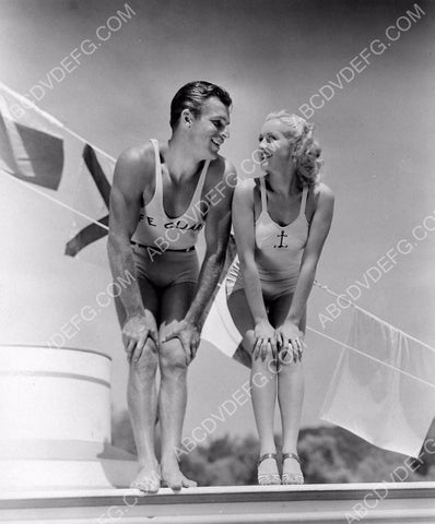 Buster Crabbe and some cutie pie in their swimwear 8b20-5652