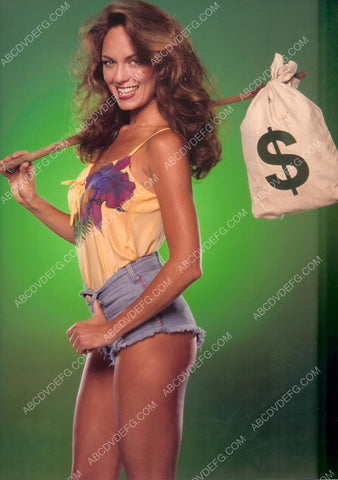 sexy Catherine Bach in Daisy Dukes hits the road w bag of money 8b20-6309