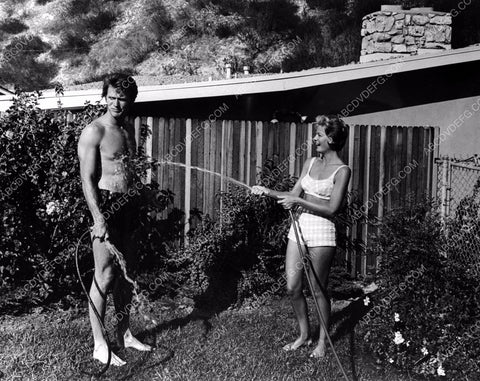 Clint Eastwood and wife play with the garden hose 8b20-6345