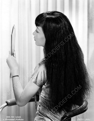 Anna May Wong does quick makeup check in the mirror 8b20-6570