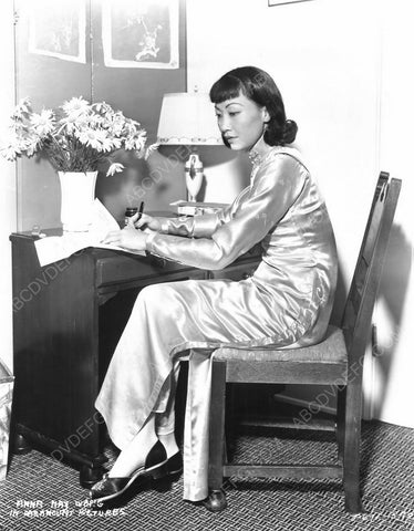 Anna May Wong composing a letter at her desk 8b20-6580