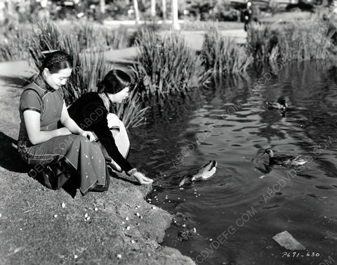 Anna May Wong and friend feed the ducks 8b20-6604