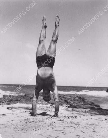 athletic Burt lancaster does handstand on the beach 8b20-7169