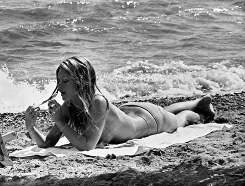 beautiful Brigitte Bardot laying in the sand 8b20-7185