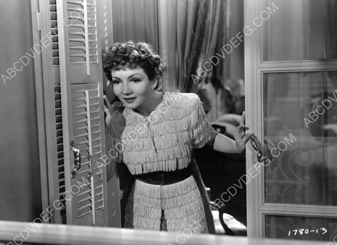 Claudette Colbert looking out the window 8b20-7695