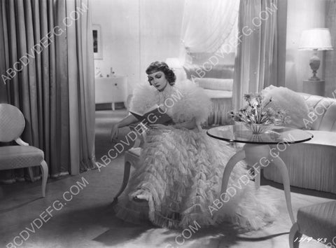 beautiful Claudette Colbert reading a book 8b20-7729