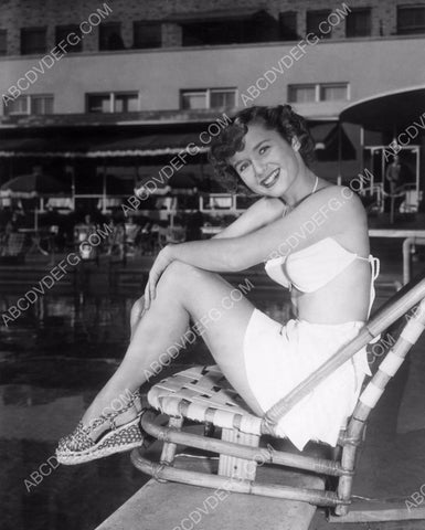 Debbie Reynolds sitting by the pool 8b20-8147