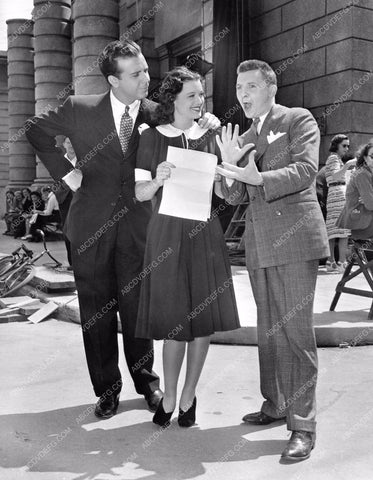 Dick Powell and others on studio backlot 8b20-8212