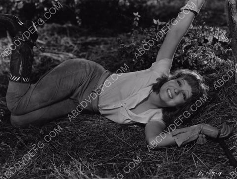 Clara Bow in cowboy boots laying in the hay 8b20-8327