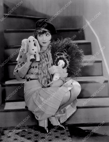 cute Clara Bow sitting on steps with stuffed animals 8b20-8333