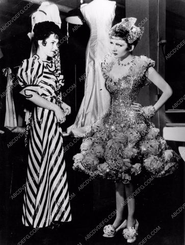 Claudette Colbert is sure the wardrobes got mixed up 8b20-8877