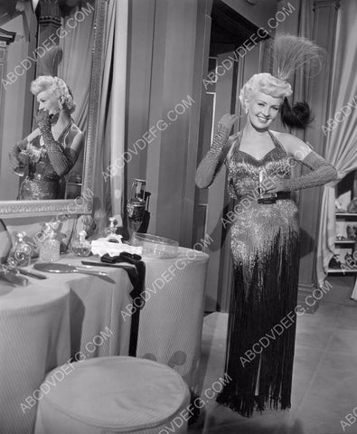 Betty Grable putting on a little perfume 8b20-8888