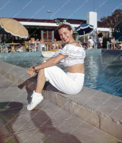 Cyd Charise sitting by the swimming pool 8b20-9386